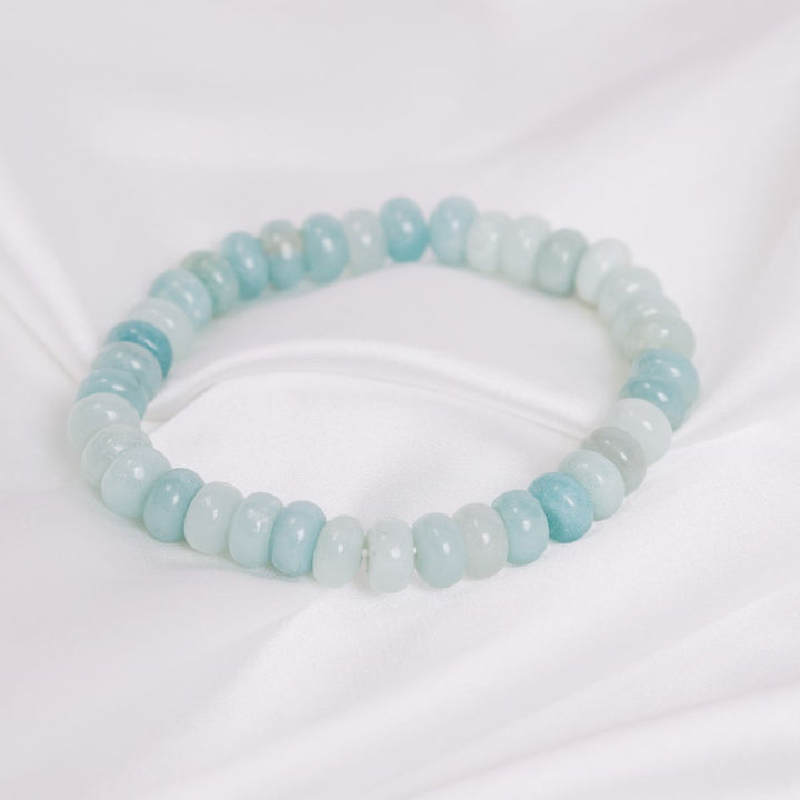 an  amazonite bracelet on a white sheet