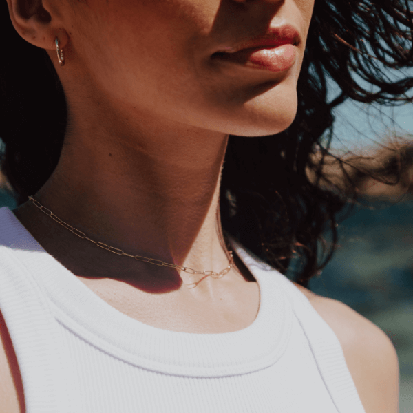 waterproof paperclip "paris" necklace on model's neck