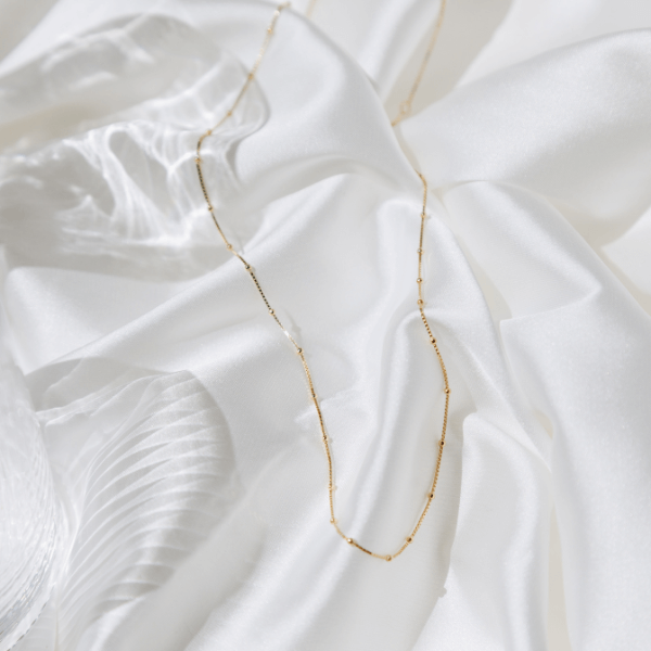 Waterproof Modern Dotted Necklace on white sheet