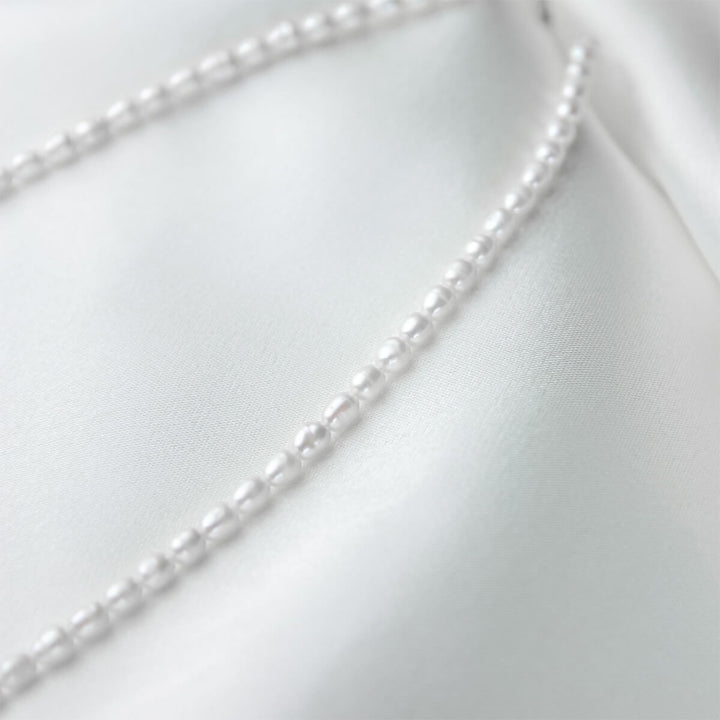 white pearl necklace close up