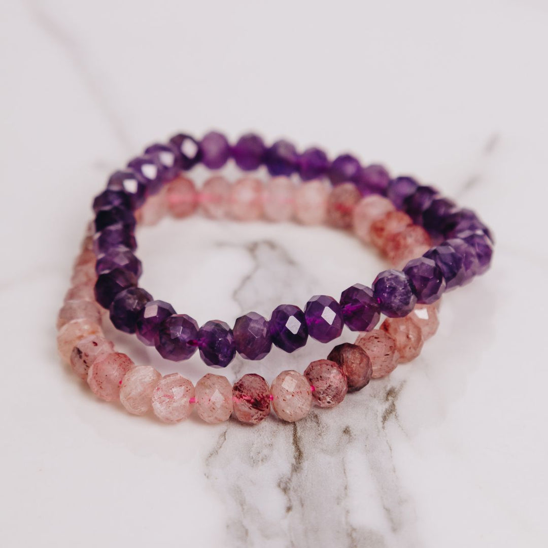 two facetted bracelets on a marble background