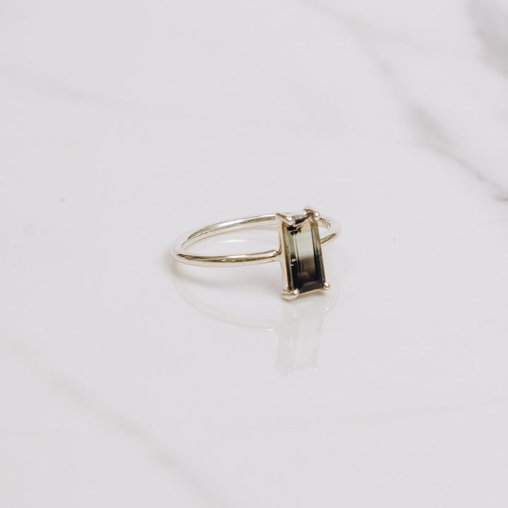 a very bold rectangular shaped ring on a white background