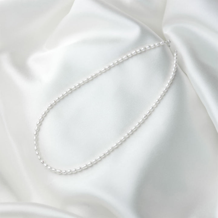 pearl necklace on satin